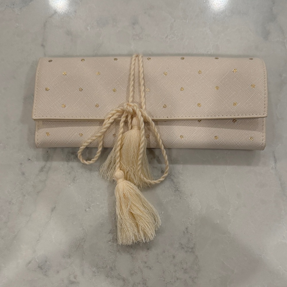 Elegant Cream Jewelry Roll with Tassel Detail